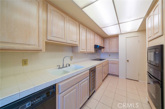 This beautiful and clean kitchen offers a lot of counter space.