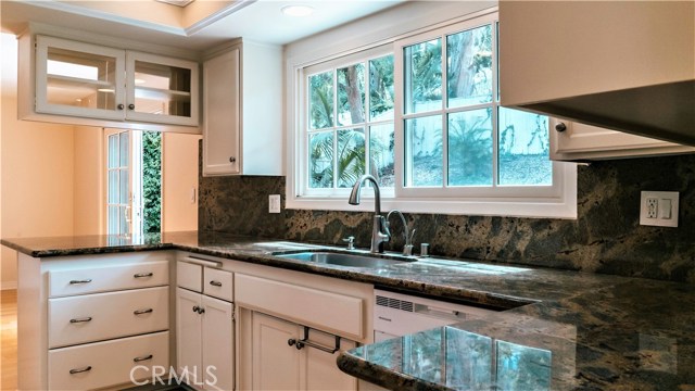 Kitchen overlooks backyard