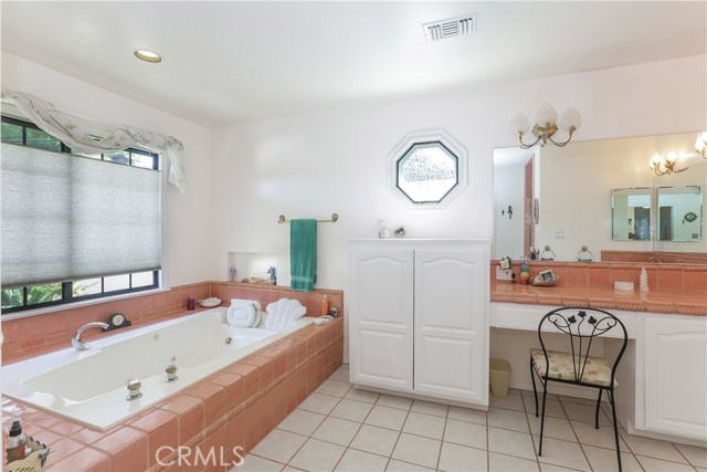 HUge master bath with whirlpool tub overlooking the lush back yard, dressing area