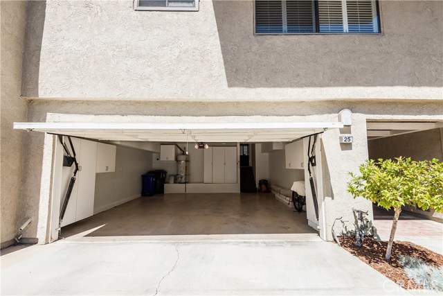 Two-car attached garage with direct access, extra storage.