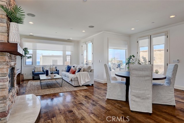 What a room.....open layout top level features beautiful stacked stone fireplace, gleaming hardwood floors, views from every angle and direct access to the oversized ocean view deck