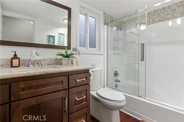 The remodeled hallway bathroom with tasteful finishes.