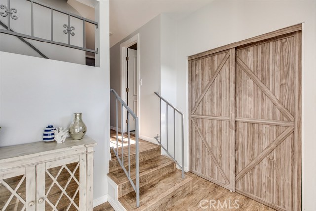 . Barn-style doors set the warm and cozy tone