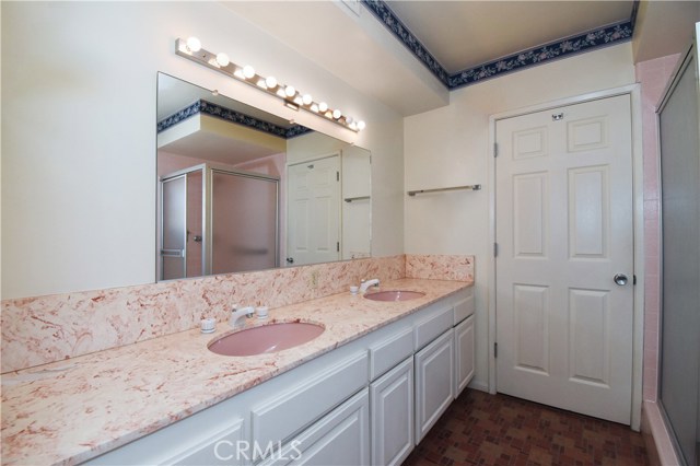 Main floor master bathroom opens to master bedroom on one side, to laundry room on the other side