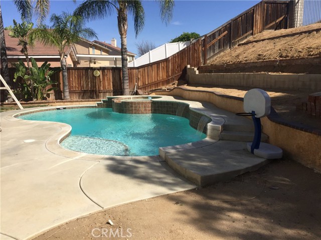 IN-GROUND PRIVATE POOL WITH HEATER AND SHALLOW END SITTING AREA