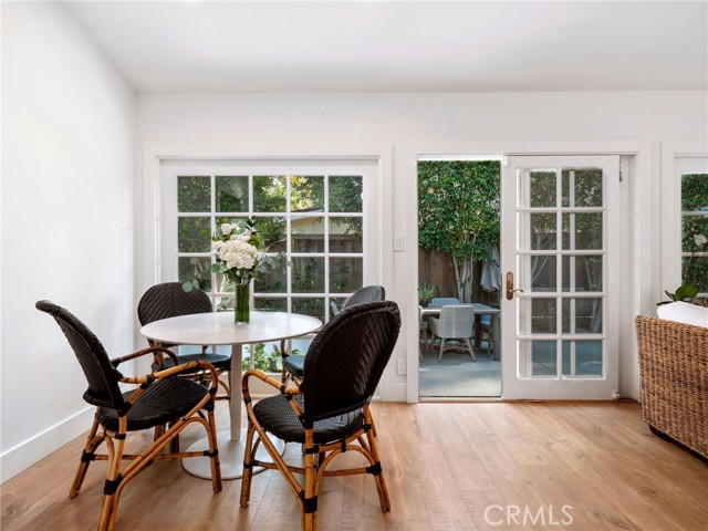 Living room and dining room open up to side patio yard