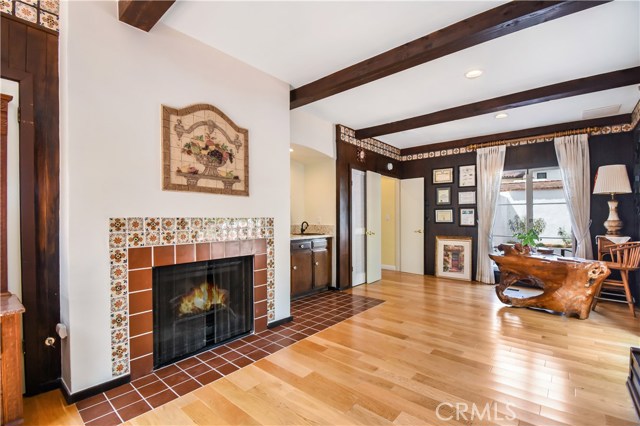 Main level bedroom room with fireplace.