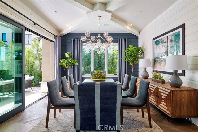 Formal dining room opens to the entry courtyard for easy indoor-outdoor living.