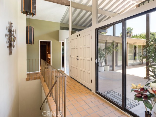 Entry with stairs to downstairs garage and workshop.