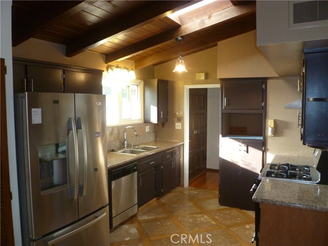 Kitchen with Vaulted Ceilings, Skylights, and Granite Countertops