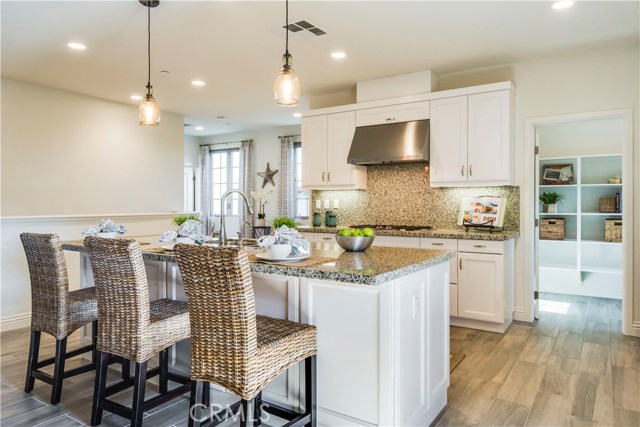 Grainte counters and pendant lights add ambience.