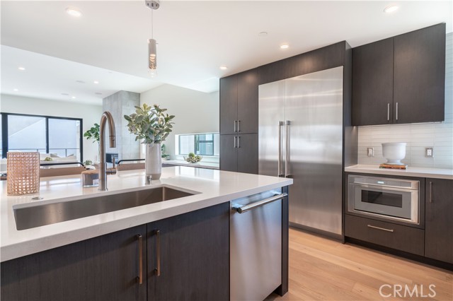 Kitchen overlooking living and dining room