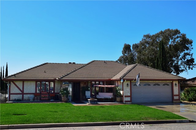 Home has a Tile Roof with Open Sitting area at Front Porch