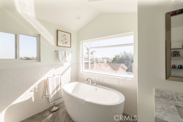 tons of natural light coming in from the bay window over the soaker tub