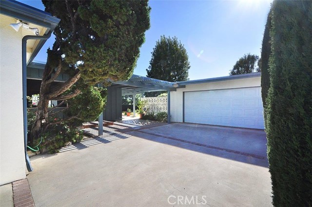 Driveway to garage and entrance to home.