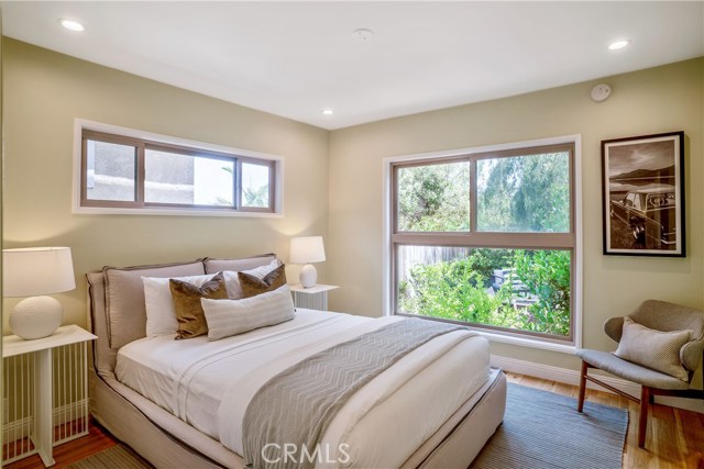 Your 1st bedroom overlooks the backyard which is filled with light and happy plants. The closet in this bedroom is new and spacious and the windows are new. The window trim matches the detail on the exterior trim of the home. Thoughtful and ready for years of enjoyment. Sweet dreams are made of this.