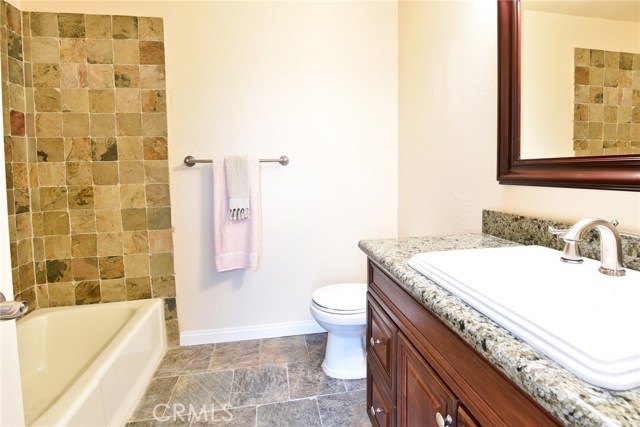 guest bathroom with full bathtub for easy access!