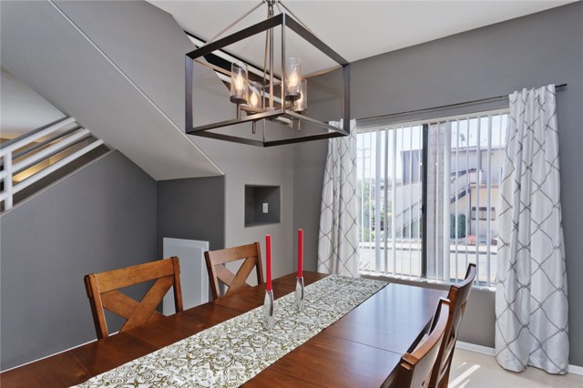 Dining room with storage space and access to the kitchen.