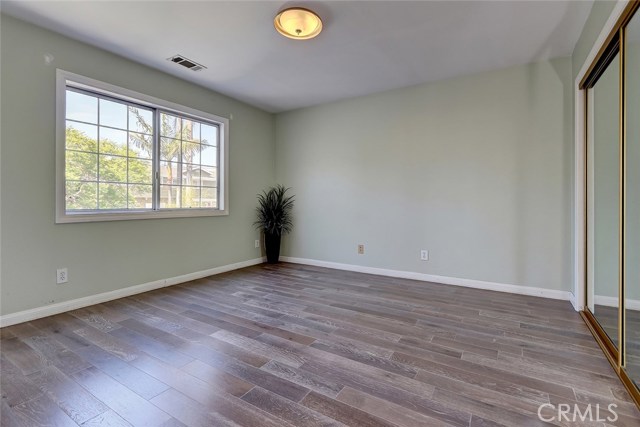 Second Floor Bedroom with Built-In Desk and Shelving