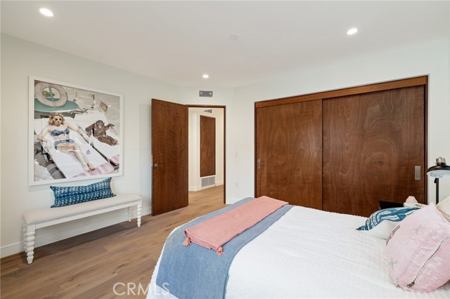 Spacious bedroom with generous closet space (shown here using reverse of 961 Unit A staging)