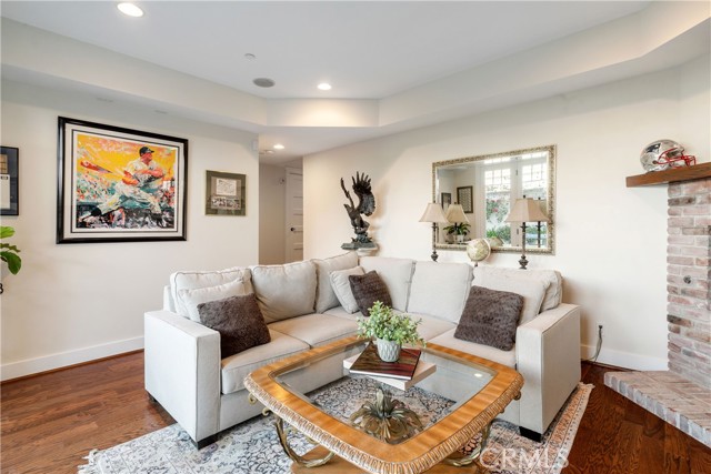 Family Room - comfortable and spacious with fireplace and access to rear yard.  Surround sound throughout the house enhances your enjoyment.