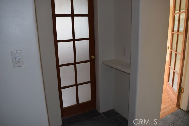 Door to 2nd bath with cute phone ledge