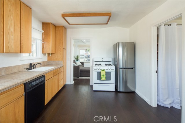 Upgraded kitchen with newer LG refrigerator. Plenty of room for breakfast table.