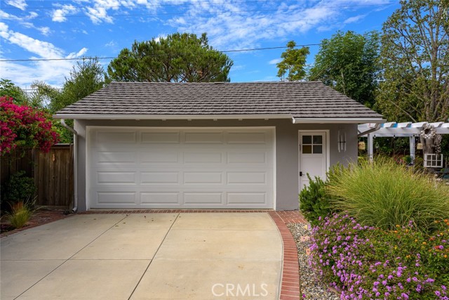 Oversized garage - perfect for parking cars, storing toys, or even converting to flex space such as a playroom, gym, office, etc.