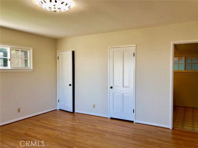 Master Bedroom with Refinished Hardwood Floors and Freshly Painted