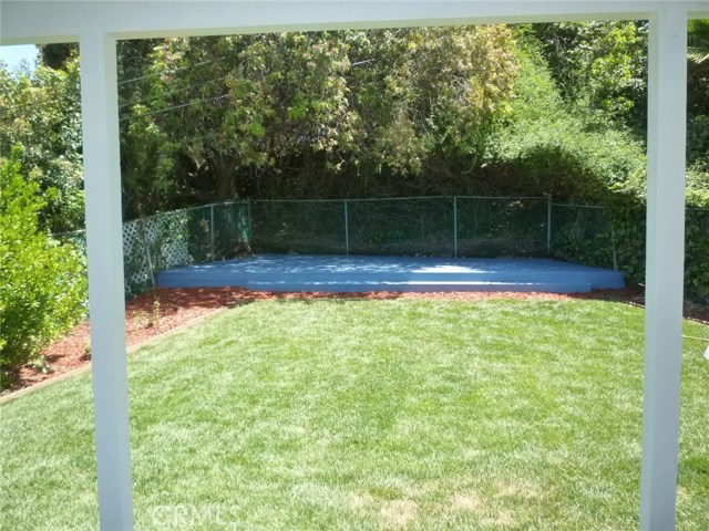 View of the wood deck as seen from the covered back patio.