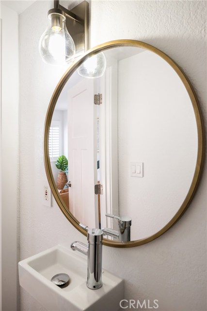 POWDER ROOM ON THE MAIN LEVEL NEXT TO THIRD BEDROOM.