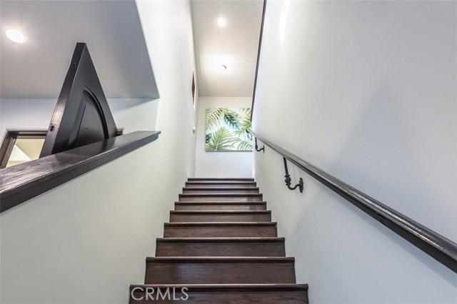 Stairs to private in-law unit, or teenager/adult get-away above garage!