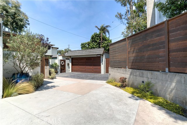 Located at the end of a private drive of three homes.  Setting is similar to a mini walk street!