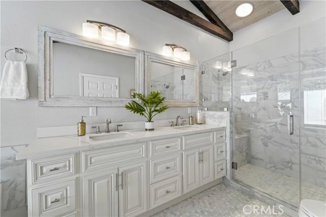 Fully renovated owners bath with two vanities and massive shower and separate soaking tub. STUNNING!