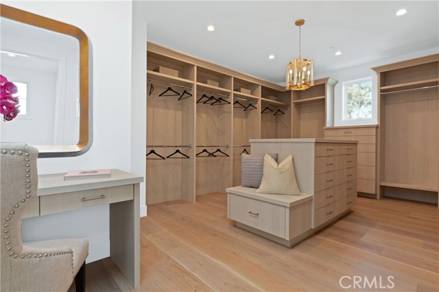 Boutique inspired master closet with private vanity