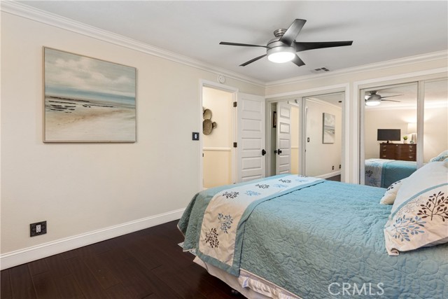 The second bedroom at the front of the home is spacious with hardwood floors and abundant closet space.