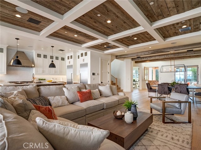 Trestlewood reclaimed wood ceiling accents and solid wood beams, huge open floor plan with chef's kitchen, whole home surround sound.