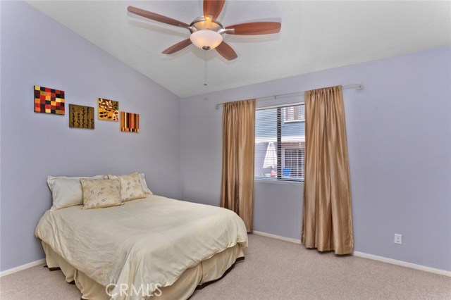 Bedroom #4 with vaulted celiing and large closet.