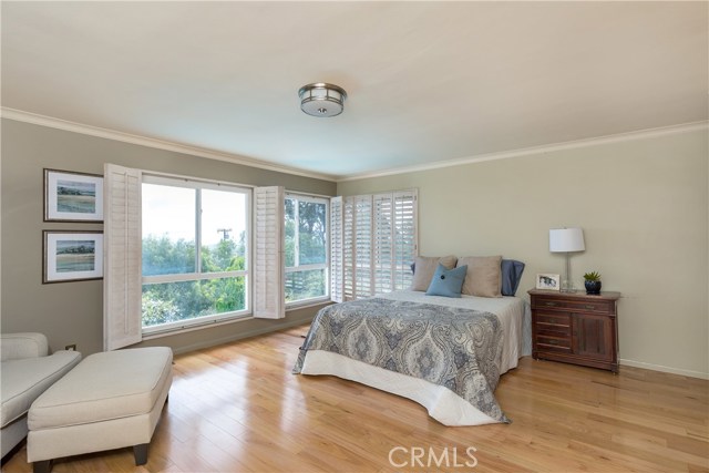 Spacious Master Bedroom with City Lights Views.