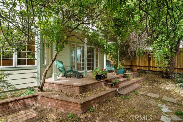 Back patio is accessed from family room with sliding door. Bay window at left of picture is breakfast nook in sunny kitchen.