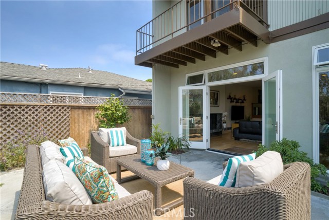 Double french doors open the yard to the living spaces.