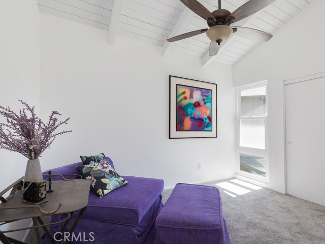 2nd bedroom with cathedral ceiling with fan a new Milgard window