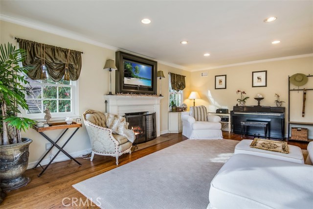 The living room is large, very classy, and features a nice view of the hills