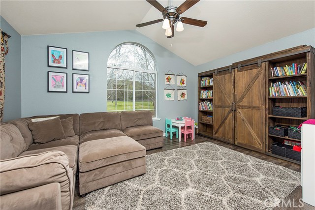 Family room with vaulted ceilings - could double as fourth bedroom