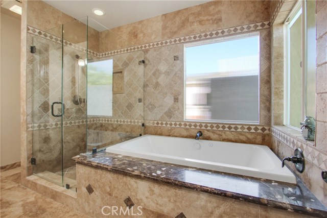 MASTER BATHROOM WITH JACUZZI TUB AND SEPERATE SHOWER. LOST OF GRANITE AND STONE TILE FLOORING