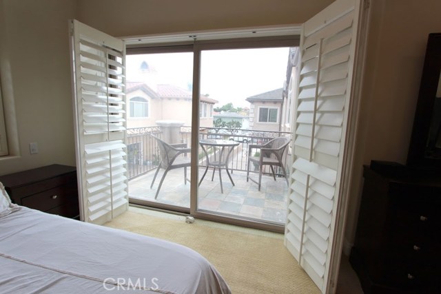 View through plantation shutters out toward balcony.