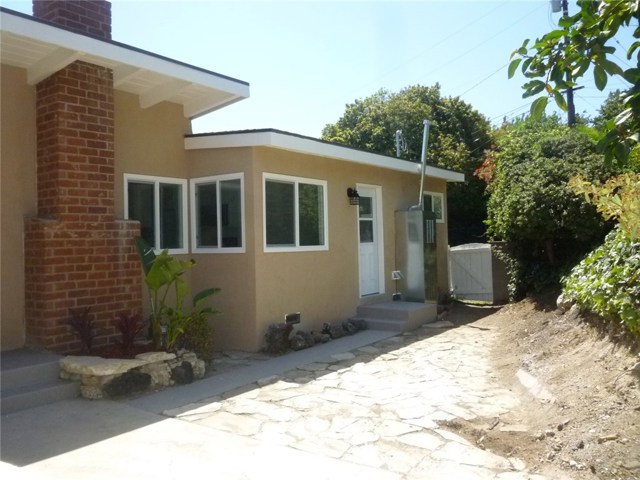 Another view of the side patio.  Fireplace is in the living room and the door leads to the kitchen and laundry area.