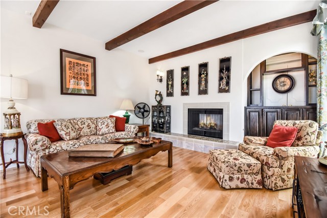 Main level living room off entry with fireplace and convenient built-in.