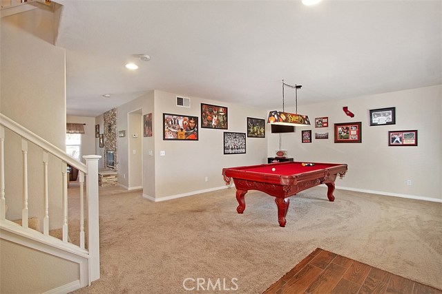 Formal living room to the right of entry is currently being used a a game room.  Lots of space and natural light.