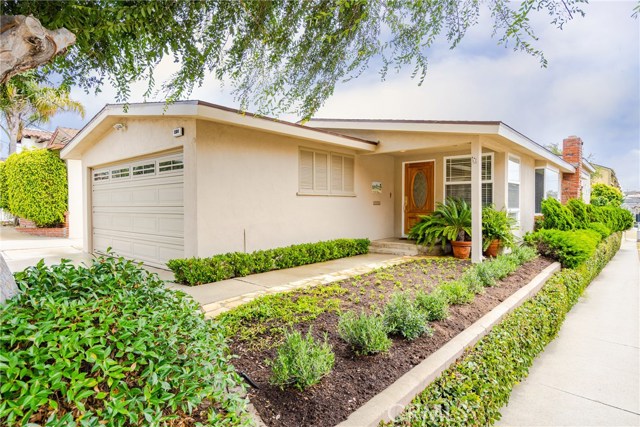 Milgaard windows, roll up garage door and beautiful front door greet your guests!